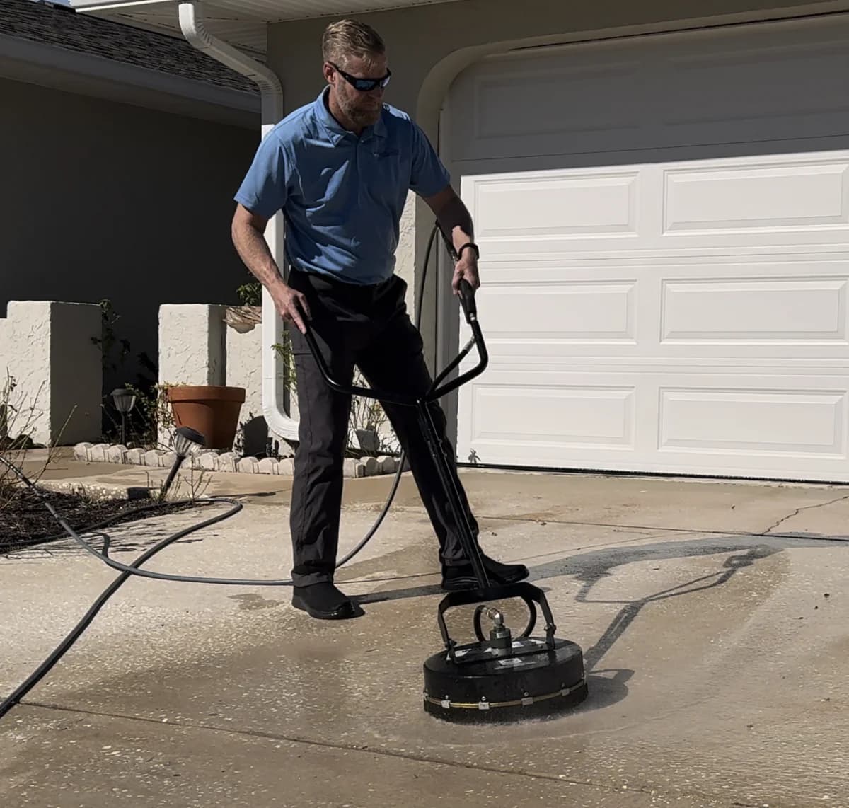 Steve cleaning a driveway in Hudson, FL - Hudson Pressure Pros