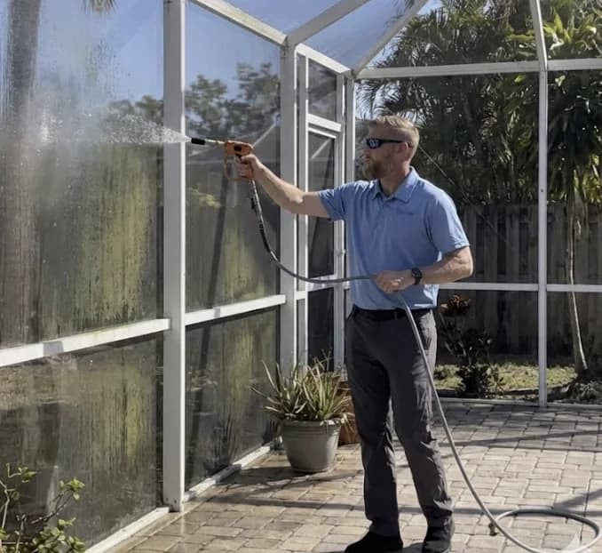 Steve cleaning a screen enclosure in Hudson, FL - Hudson Pressure Pros